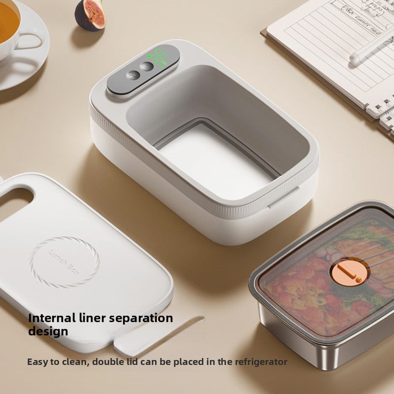 Electric lunch box warming a meal on a desk without a mains plug