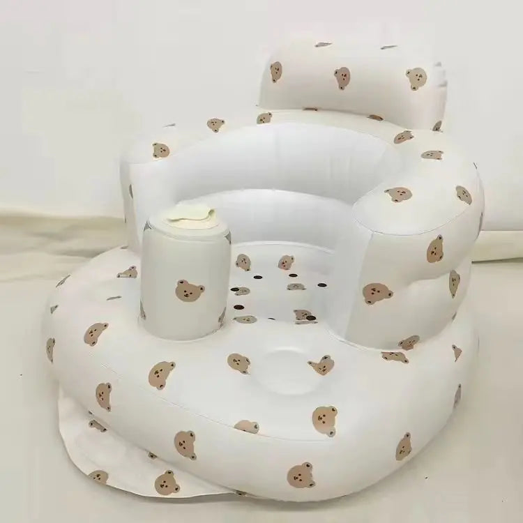 Portable baby seat deflated and folded flat for a changing bag