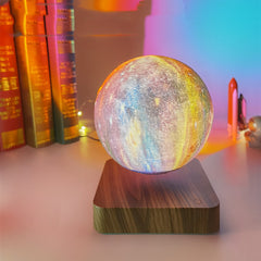 Levitating galaxy lamp floating and spinning above its magnetic base