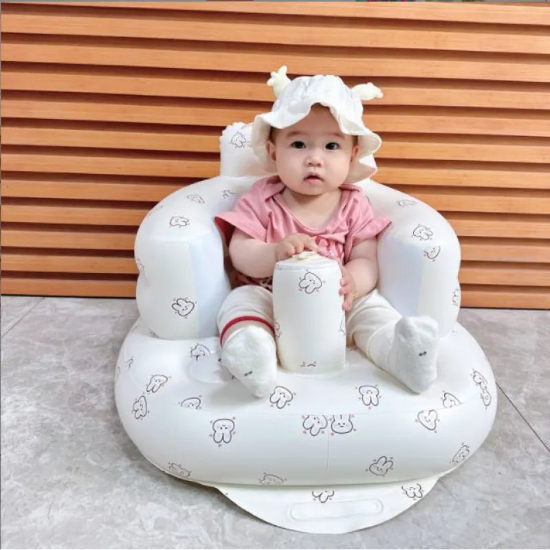Inflatable baby bath seat with wipe-clean surface and soft back rest