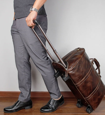 Large cowhide leather trolley travel bag with wheels and retractable handle