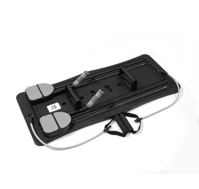 Pilates board in use with resistance bands attached