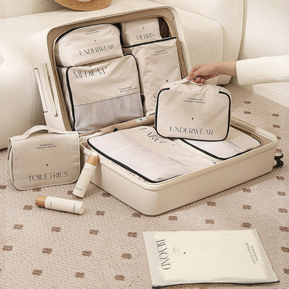 Travel storage bag set neatly organized in a suitcase, showcasing various bags for clothing and accessories.